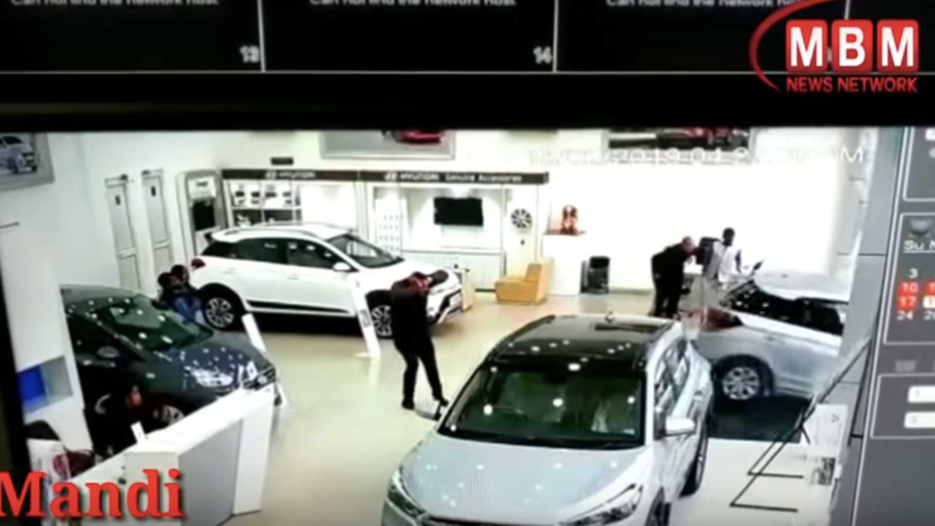 Women Crashes Hyundai Out of the Dealership Window 1
